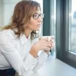 portrait-of-pretty-business-woman-drinking-coffee-picture-id618544230