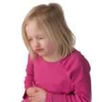 Child with stomach ache on a white background