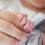 new-born-baby-with-his-mother-picture-id915147672