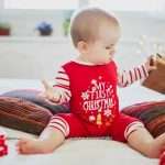 happy-little-baby-girl-opening-christmas-presents-on-her-very-first-picture-id1181896186