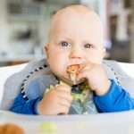 baby-boy-eating-with-blw-method-baby-led-weaning-picture-id868494964