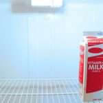 solitary-carton-of-milk-in-a-white-fridge-picture-id172252518