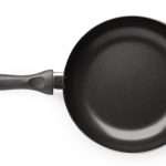 new-empty-frying-pan-isolated-on-white-background-on-top-view-with-picture-id928434062