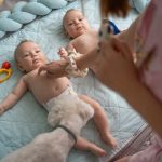 Babies enjoying playing with mother early in the morning